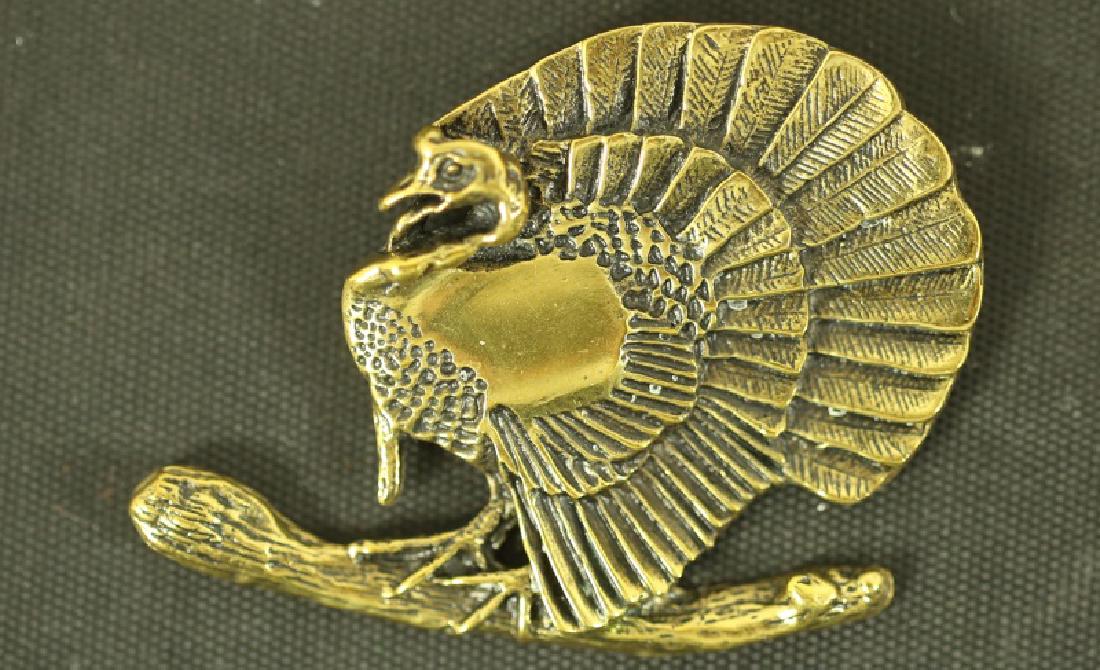 SIGNED AVERY BRASS CUSTOM DESIGNED TURKEY PENDANT: SOLID BRASS CUTOM DESIGNED TURKEY PENDANT, SIGNED BY ARCH AVERY JR. OF DALLAS, 1986. Height: 1.5 in. by Width: 2 in.