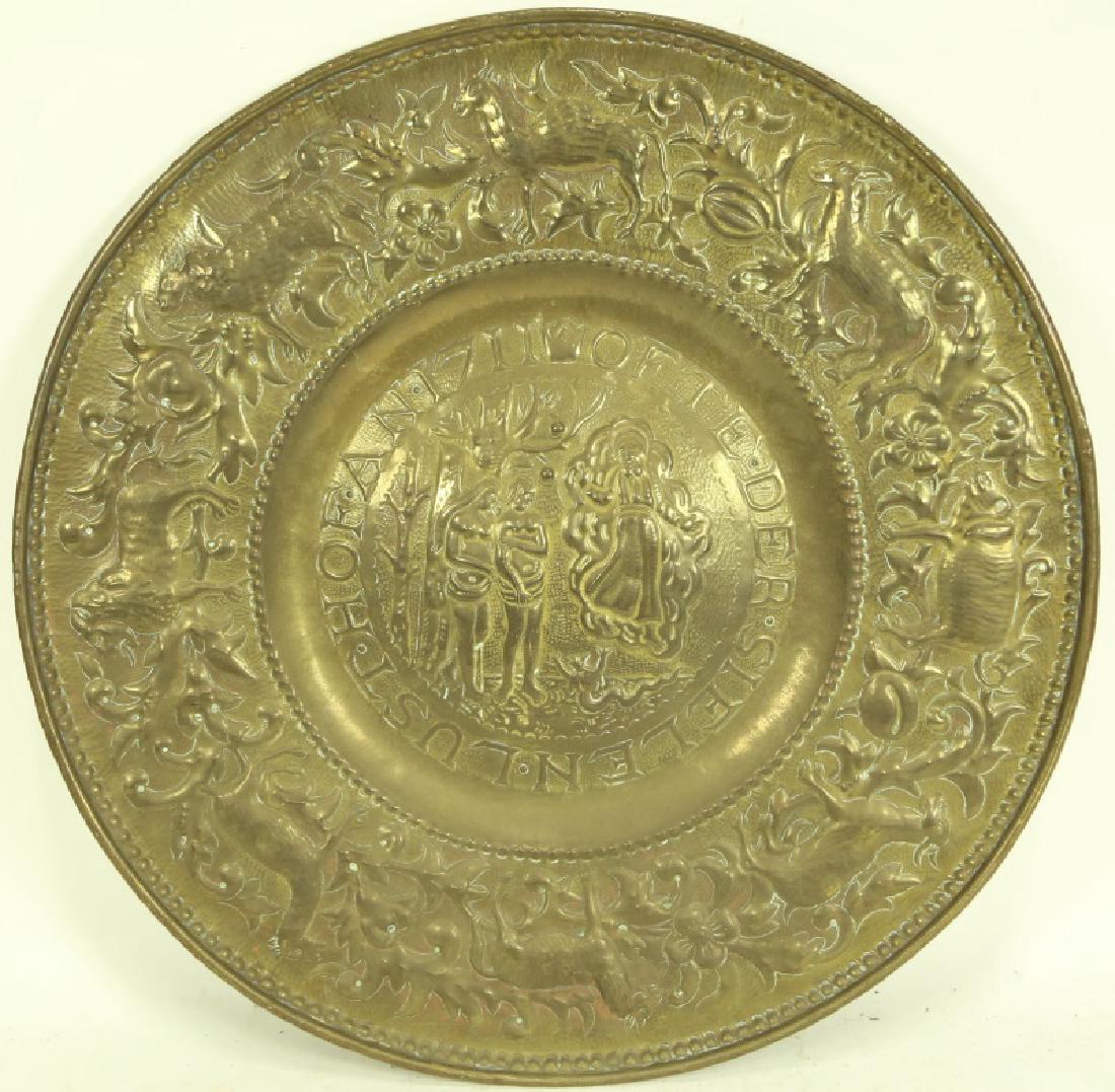 CIRCA 1711 GERMAN MOMUNETAL BRASS CHARGER: CIRCA 1711 GERMAN MOMUNETAL BRASS CHARGER WITH ADAM AND EVE BEING EXPELLED FROM THE GARDEN OF EDEN. Height: 1.5 in. by Width: 25 in.
