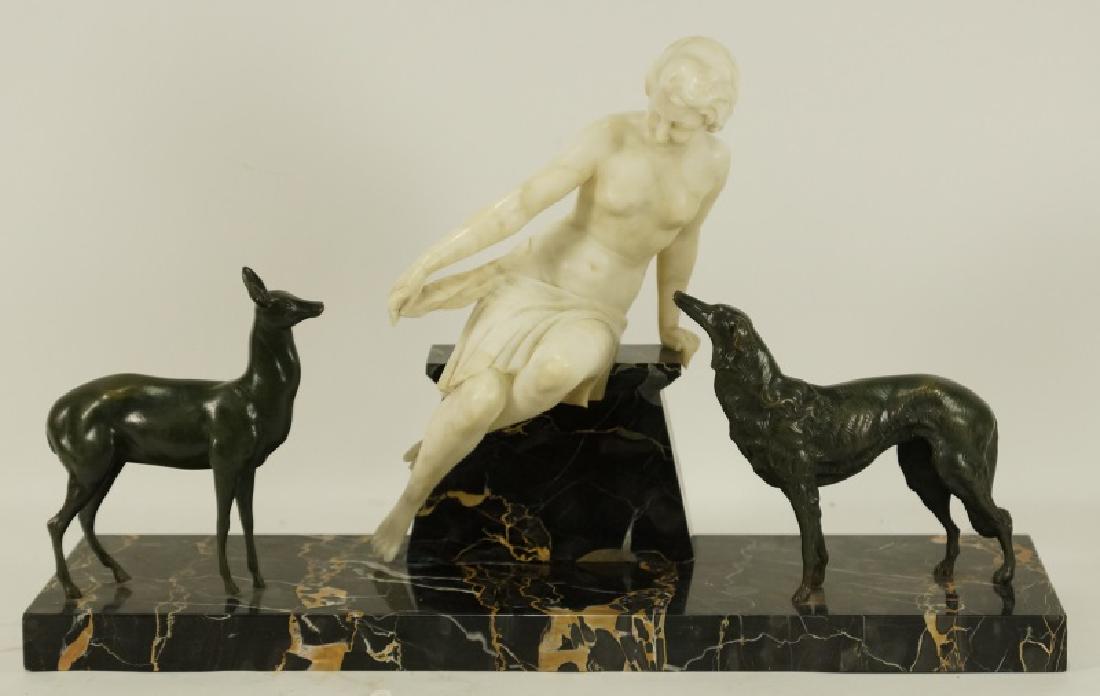 T. POZZI "DIANA GODDESS OF THE HUNT" SCULPTURE: T. POZZI (18th/19th CENTURY) "DIANA GODDESS OF THE HUNT" SCULPTURE, CIRCA 1910-1915, CARVED MARBLE FIGURE WITH BRONZE FAUN AND DOG AND BLACK MARBLE TIERED BASE, SIGNED ON THE BACK. 16"H X 28"W X 8"D.