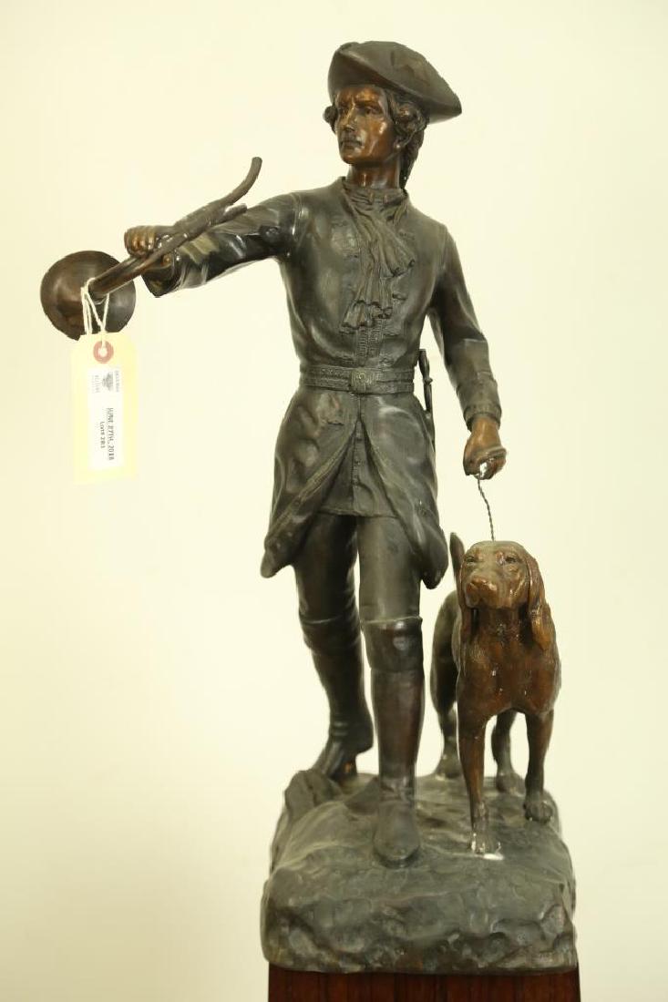 ANTIQUE BRONZE HUNTER AND DOG SCULPTURE