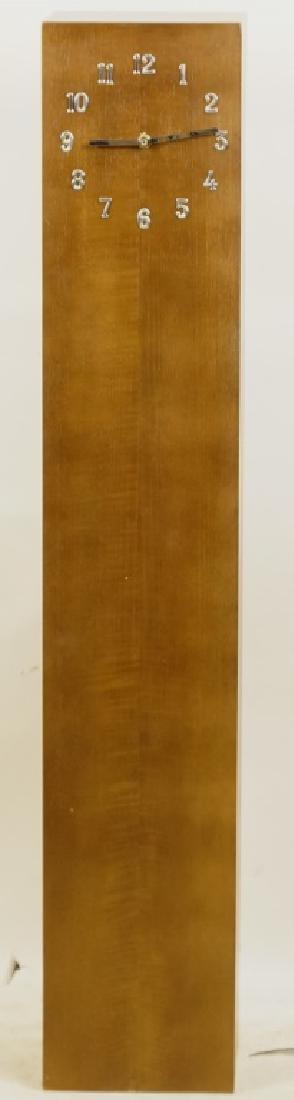 RAYMOR BATTERY CLOCK: RAYMOR BATTERY CLOCK. Height: 43 1/2 in. by Width: 8 in. by Depth: 8 in.