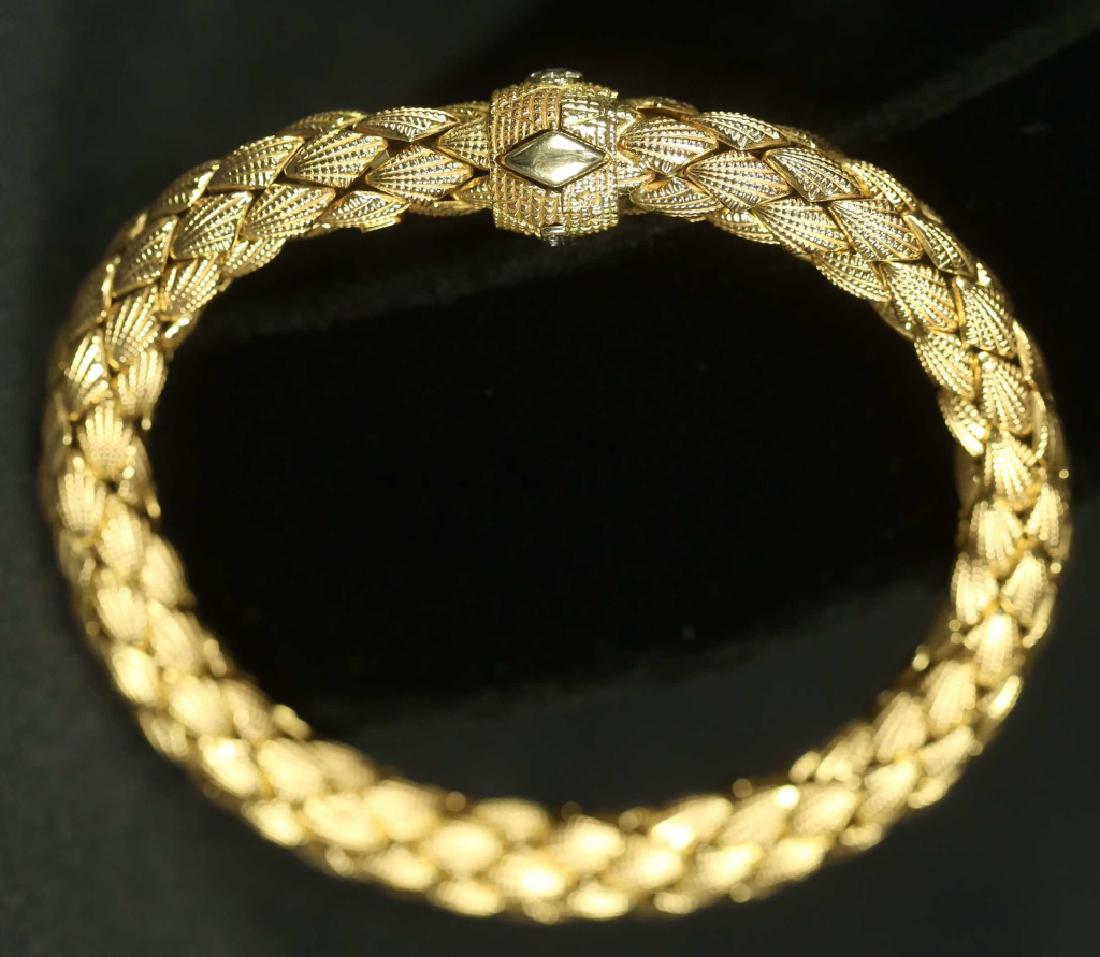 "750-CHIMENTO-V.I." 18KT ROSE G. DIAMOND BRACELET: A STAMPED "750-CHIMENTO-V.I." 18KT ROSE GOLD DIAMOND BRACELET. THIS 8" X 3/8 ROUND ITALIAN MADE NEW BRACELET HAS A 0.03CT DIAMOND SET IN THE CLASP. THIS FLEXIBLE BRACELET IS VERY COMFORTABLE ON THE WR