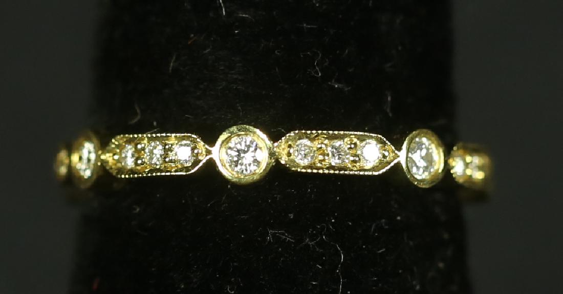 A STAMPED "18KT" YELLOW GOLD DIAMOND RING (1 of 2)