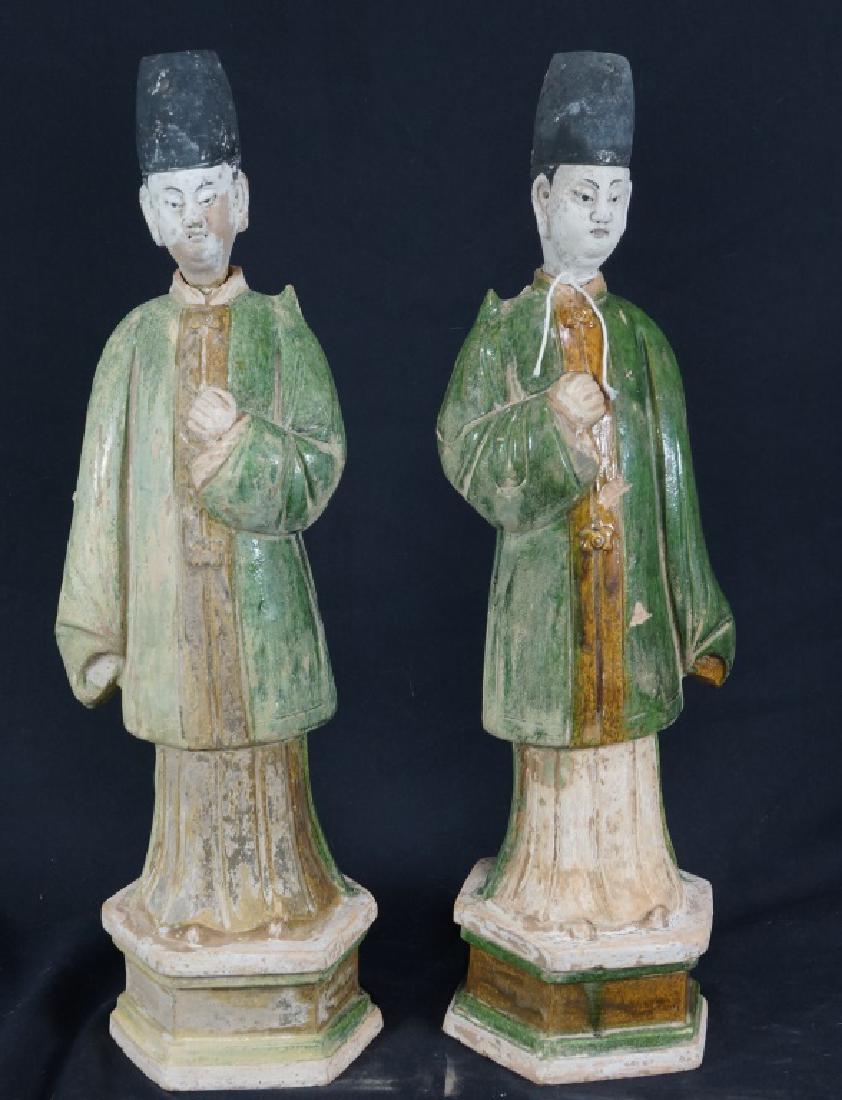 PAIR OF CHINESE MING DYNASTY GLAZED COURTIERS: PAIR OF CHINESE MING DYNASTY GLAZED CERAMIC COURTIERS. WITH APPRAISAL. Height: 19 in. by Width: 6 in. by Depth: 6 in.