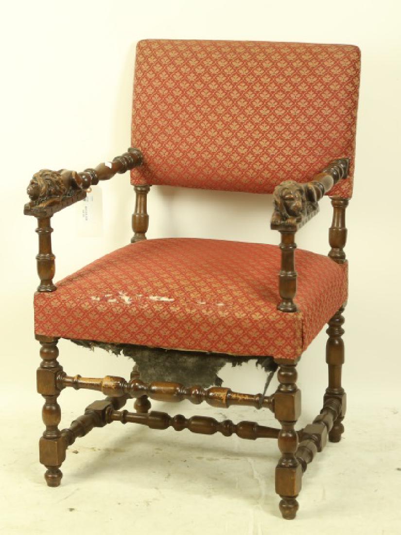 19th CENTURY CARVED OAK & LEATHER ARMCHAIR: CIRCA 1900 RECLINING LION ARMCHAIR. Height: 37 in. by Width: 24 in. by Depth: 23 in.