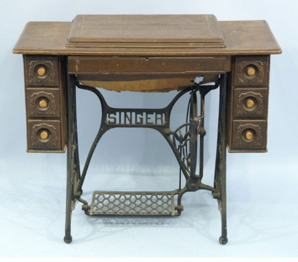 Singer sewing cabinet with sewing machine. Size: Singer sewing cabinet with sewing machine. Size: 36" x 31" x 18".