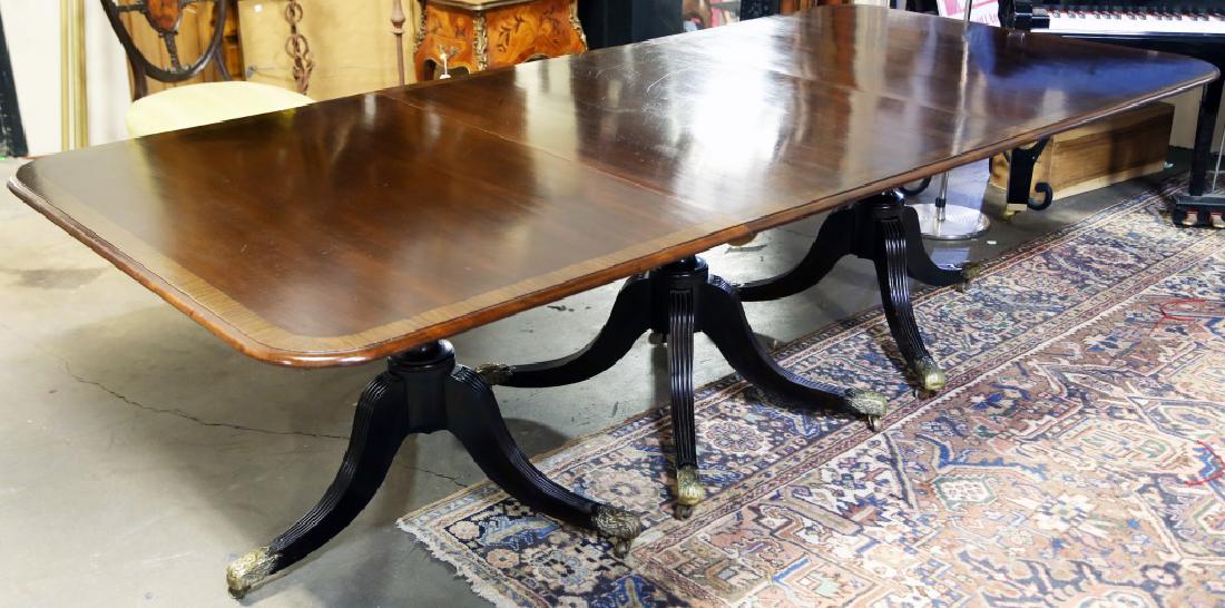 CIRCA 1900 GEORGIAN STYLE TRIPLE PEDESTAL TABLE: CIRCA 1900 GEORGIAN STYLE TRIPLE PEDESTAL DINING TABLE. HAS TWO 20.5 "LEAVES. Height: 30 in. by Width: 143 in. by Depth: 48 1/2 in.