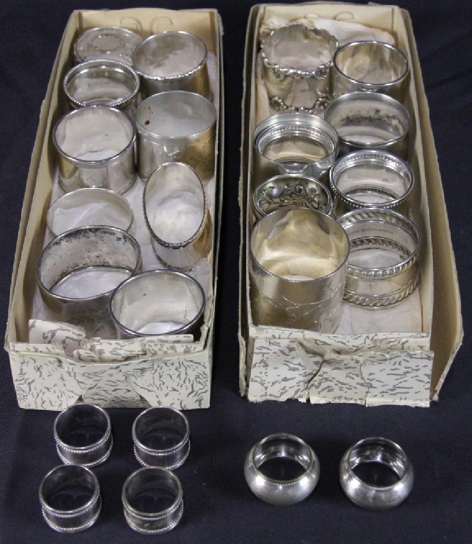 MIXED LOT OF 24 STERLING SILVER NAPKIN RINGS: MIXED LOT OF 24 STERLING SILVER NAPKIN RINGS. 571 GRAMS T.W.