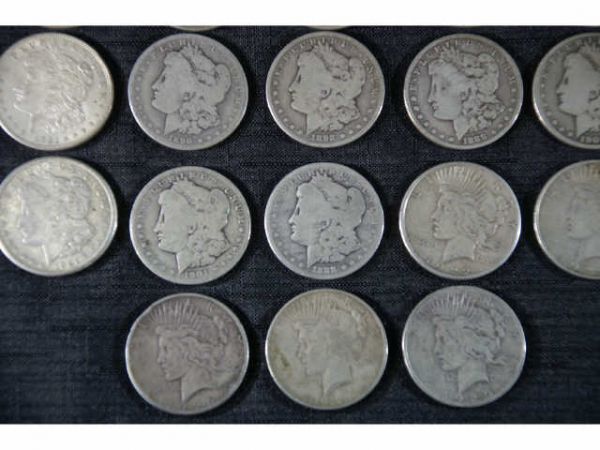 57 assorted coins. 32 Morgan dollars and 25 Peace - 3