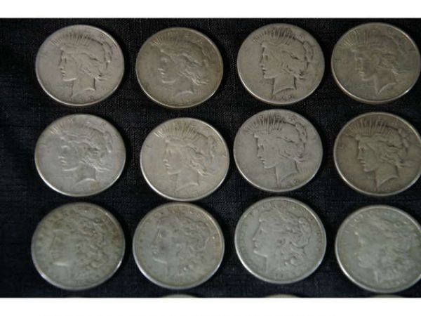 57 assorted coins. 32 Morgan dollars and 25 Peace - 5