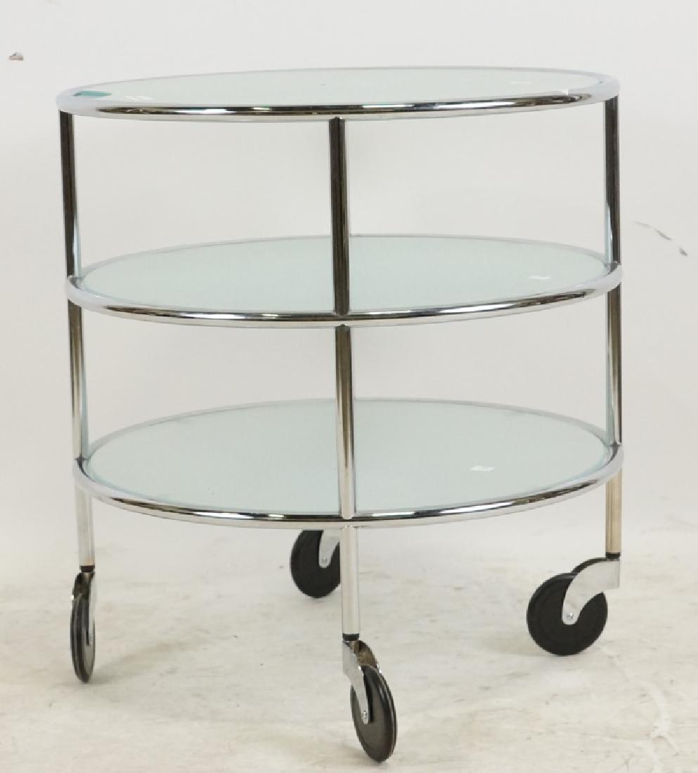 CASSINA CONTEMPORARY METAL TABLE ON CASTERS: CASSINA CONTEMPORARY METAL TABLE ON CASTERS. Height: 22 in. by Width: 21 in. by Depth: 21 in.
