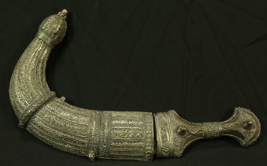 ANTIQUE NORTH AFRICAN YEMENESE JAMBIYAH DAGGER: ANTIQUE NORTH AFRICAN YEMENESE JAMBIYAH DAGGER, 1825-1875. Height: 15 in. by Width: 9 1/2 in. by Depth: 2 in.