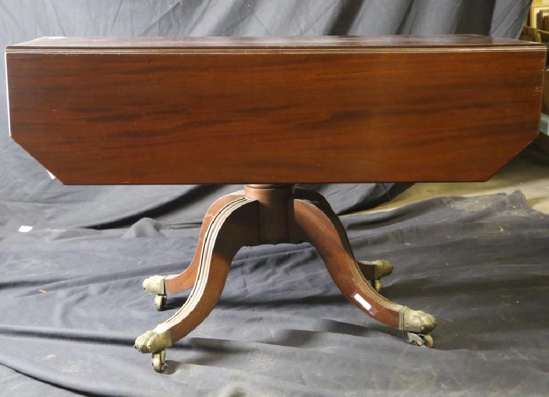 19th CENTURY ENGLISH MAHOGANY DROP LEAF TABLE: 19th CENTURY ENGLISH MAHOGANY DROP LEAF TABLE. FRIEZE DRAWER; BRONZE PAW FEET; BRONZE CASTERS. PROVENANCE: NORBERT'S ANTIQUES, HOUSTON, TEXAS. Height: 28 1/2 in. by Width: 44 1/2 in. by Depth: 20-41 1