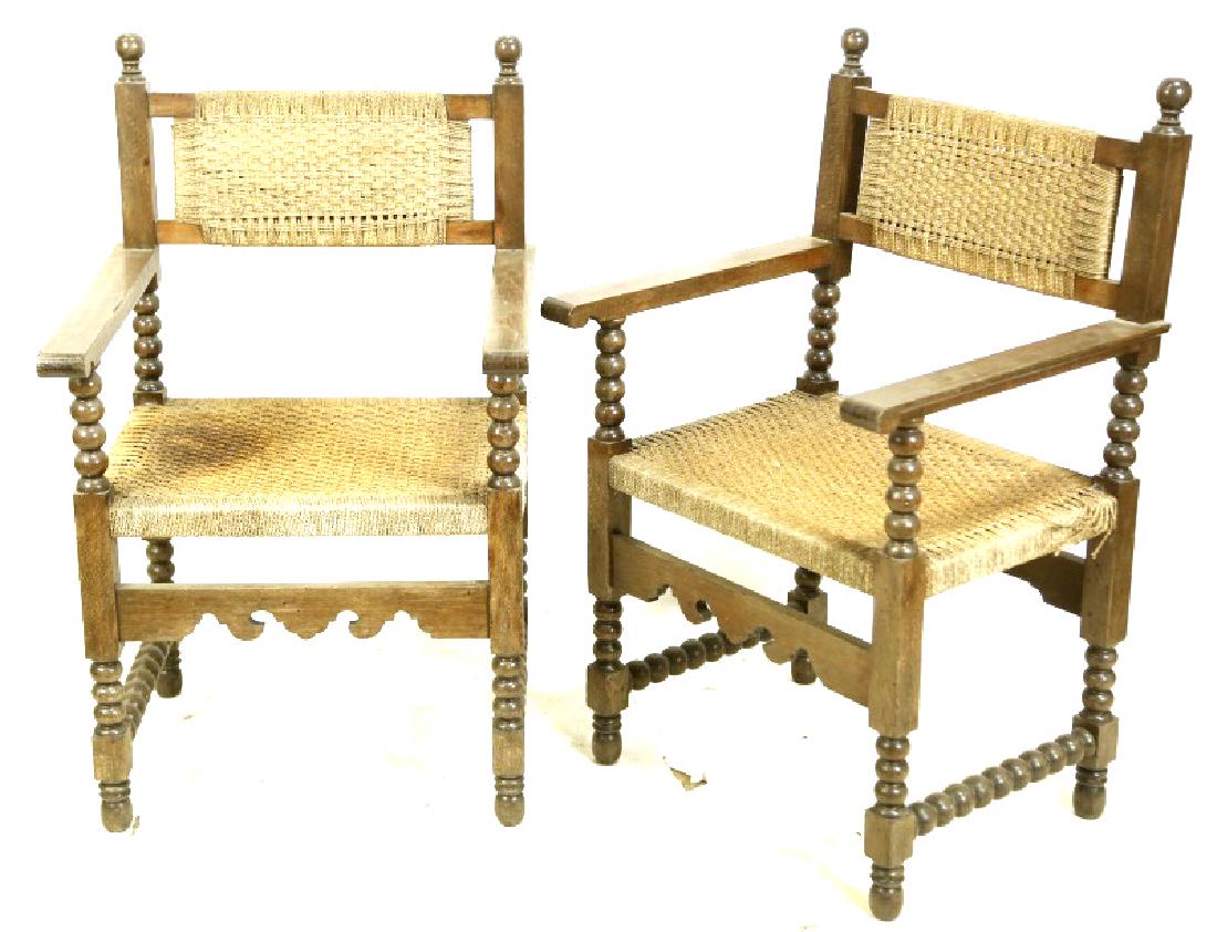 PAIR OF ANTIQUE SPANISH OAK ARMCHAIRS: PAIR OF ANTIQUE SPANISH OAK ARMCHAIRS WITH BOBIN TURNED LEGS AND WOVEN JUTE SEATS. Height: 40 in. by Width: 24 1/2 in. by Depth: 22 in.
