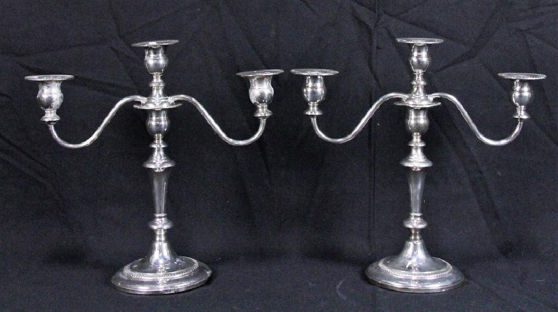 PAIR OF STERLING SILVER CANDELABRA: PAIR OF STERLING SILVER CANDELABRA WITH WEIGHTED BASES. Height: 11 1/2 in. by Width: 12 in. by Depth: 5 IN.