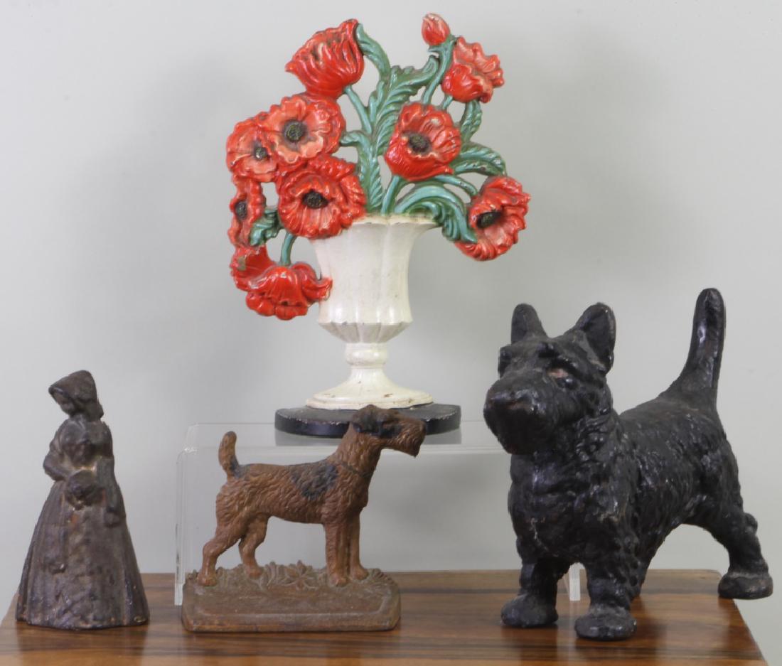FOUR PIECE CAST IRON DOOR STOPS (1 of 1)