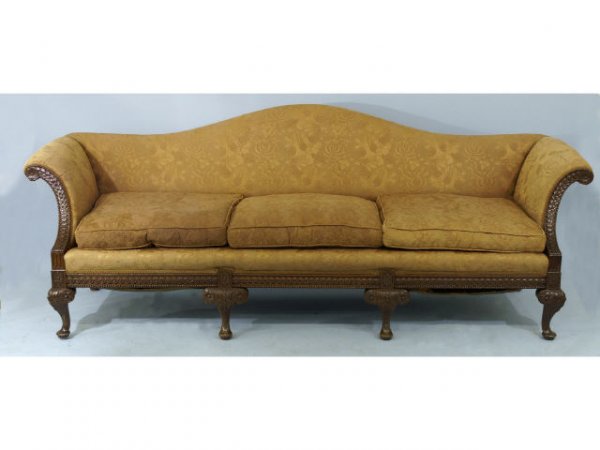 A 19th century English mahogany camelback sofa.