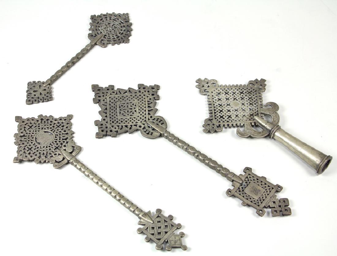 SET OF FOUR VINTAGE METAL COPTIC CROSSES: SET OF FOUR VINTAGE METAL COPTIC CROSSES. Height: 12 1/2 in. by Width: 4 1/2 in. by Depth: 1/2 in.