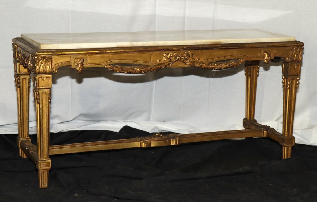 CIRCA 1800's FRENCH GILT CARVED COFFEE TABLE: CIRCA 1800's FRENCH CARVED AND GILDED MARBLE TOP COFFEE TABLE. Height: 21 in. by Width: 42 in. by Depth: 15.5