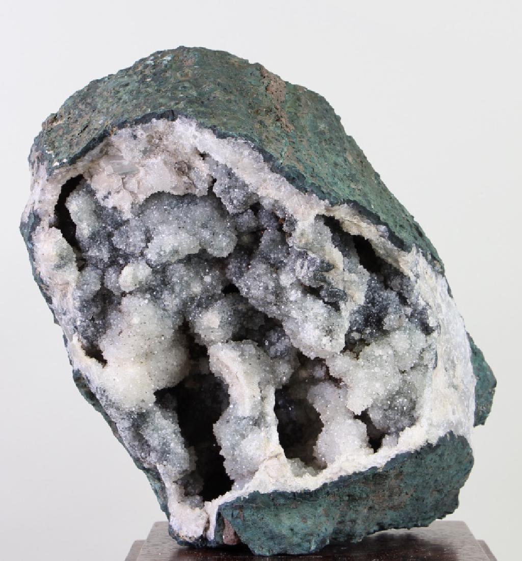 MOSS AGATE DRUZY GEODE ON BASE: MOSS AGATE DRUZY GEODE ON BASE Height: 10 in. by Width: 10 in. by Depth: 7 1/2 in.