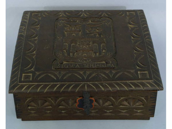 Antique wooden box with elaborate carvings. "Segur