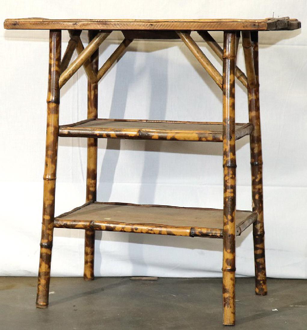 ANTIQUE BAMBOO SMALL TABLE: ANTIQUE BAMBOO SMALL TABLE. SOLD IN AS IS CONDITION. Height: 28 in. by Width: 25 in. by Depth: 17 in.