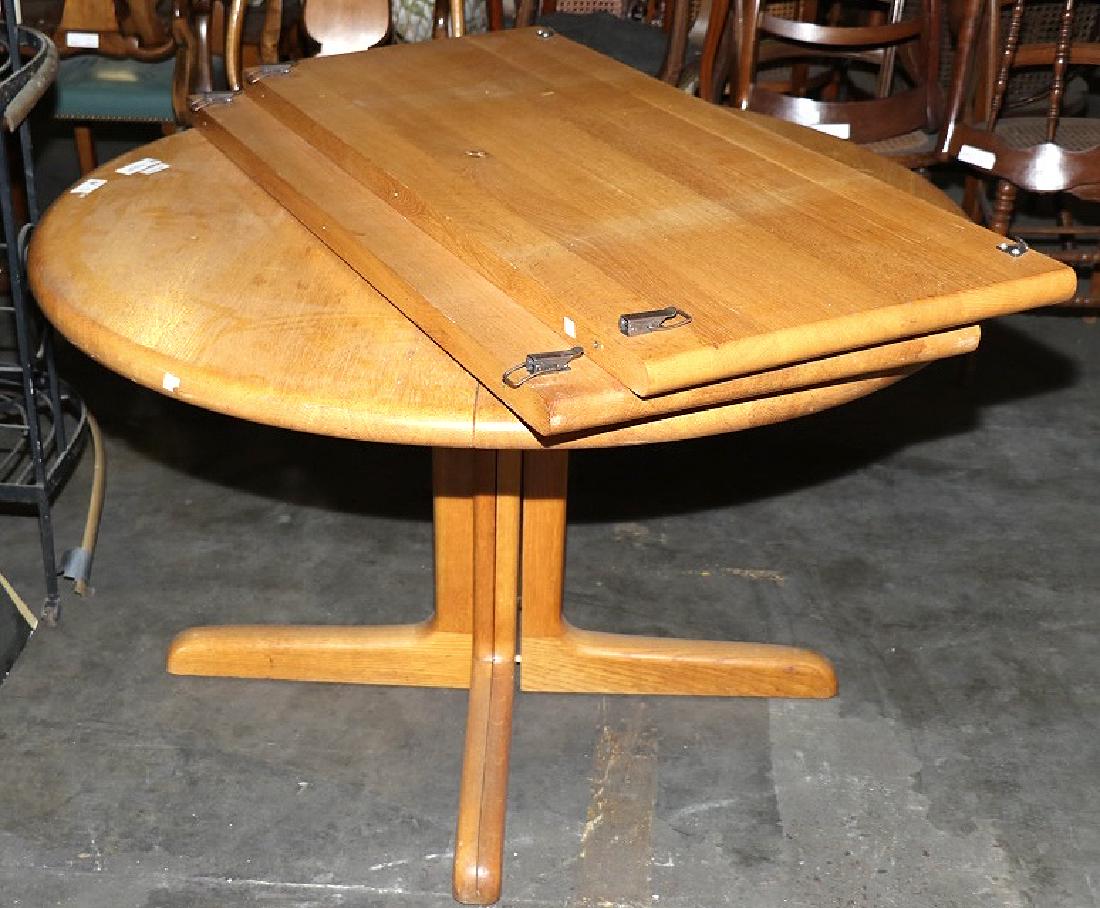 VINTAGE DANISH MODERN OAK TABLE: VINTAGE DANISH MODERN OAK TABLE. ROUND TABLE. TWO LEAVES, TABLE=29" X 29" ROUND, EXTENDABLE TO 29" X 47".