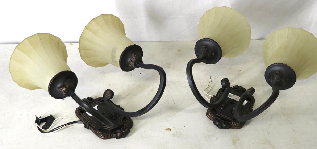 PAIR OF IRON & GLASS TWO-LIGHT WALL SCONCES: PAIR OF IRON & GLASS TWO-LIGHT WALL SCONCES. Height: 11 in. by Width: 5 in.