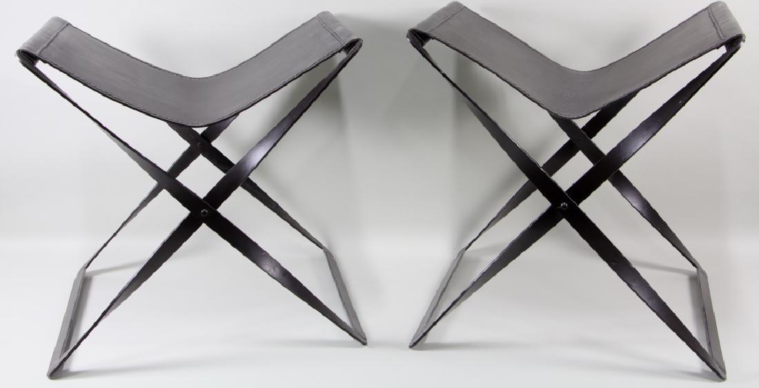 PAIR OF LEATHER FOLDING CAMPING STOOLS: PAIR OF LEATHER FOLDING CAMPING STOOLS. Height: 19 in. by Width: 23 in. by Depth: 19 in.