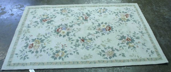White rug with flowers.