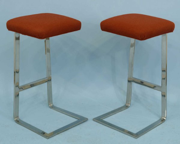 2 barstools with red cushion