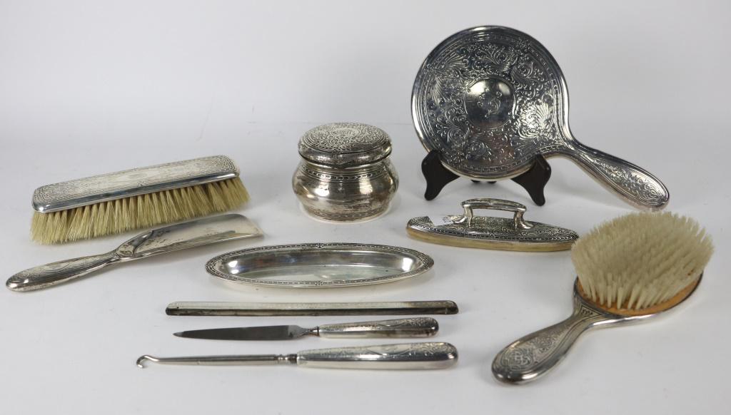 TIFFANY STERLING SILVER GROOMING 10 PIECE SET: TIFFANY STERLING SILVER GROOMING 10 PIECE SET. - FROM THE RUNNELS/FIRESTONE ESTATE. CANNOT GIVE ACCURATE WEIGHT BECAUSE OF MIRROR AND PLASTER. Height: 3 in. by Width: 4 1/2 in. by Depth: 4 1/2 in.