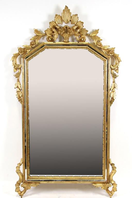 ANTIQUE GILT & CARVED MIRROR: ANTIQUE GILT & CARVED MIRROR. Height: 39 in. by Width: 22 1/2 in. by Depth: 2 1/2 in.
