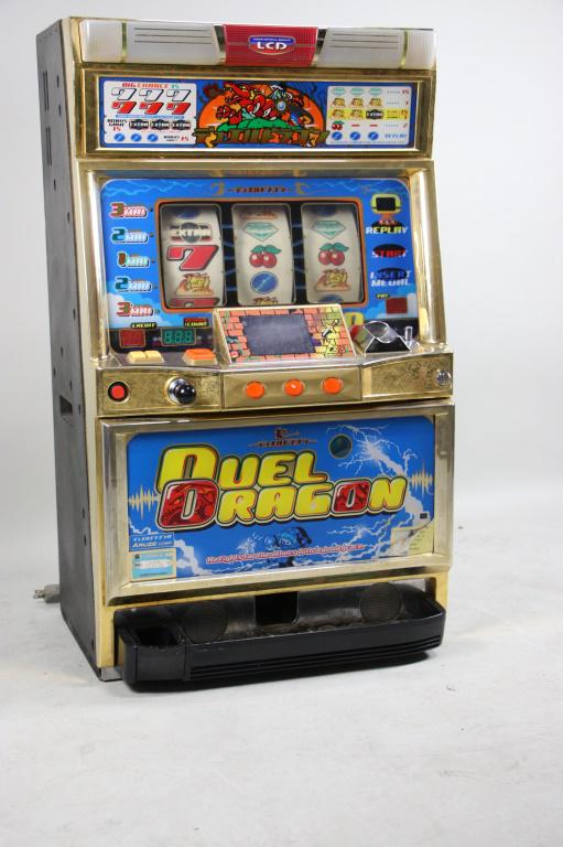 LIQUID CRYSTAL DISPLAY DUEL DRAGON SLOT MACHINE: LIQUID CRYSTAL DISPLAY DUEL DRAGON SLOT MACHINE Height: 32 in. by Width: 18 3/4 in. by Depth: 12