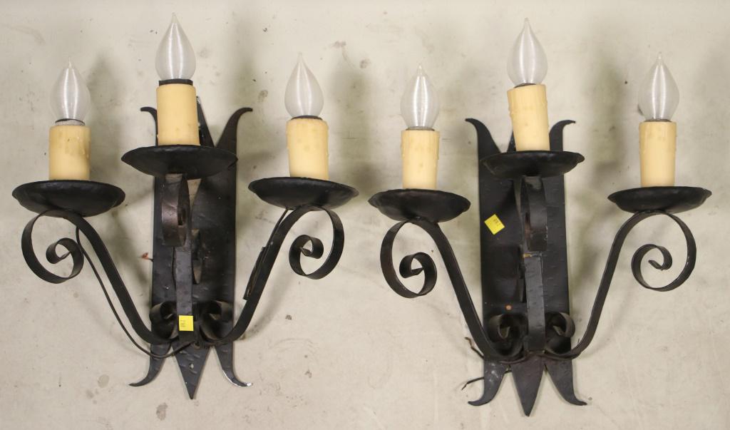 PAIR OF WROUGHT IRON WALL SCONCES: PAIR OF WROUGHT IRON WALL SCONCES. Height: 18 in. by Width: 16 in. by Depth: 9 in.