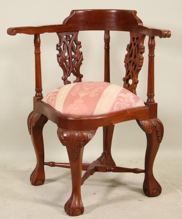 CHIPPENDALE STYLE CORNER ARMCHAIR: CHIPPENDALE STYLE CORNER ARMCHAIR ON BALL AND CLAW LEGS. Height: 33 in. by Width: 29 in. by Depth: 25 in.