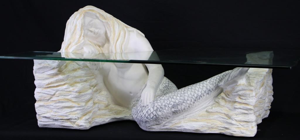 CAST PLASTER MERMAID BASE GLASS TOP COFFEE TABLE: CAST PLASTER MERMAID BASE GLASS TOP COFFEE TABLE. Height: 25 in. by Width: 52 in. by Depth: 32 in.