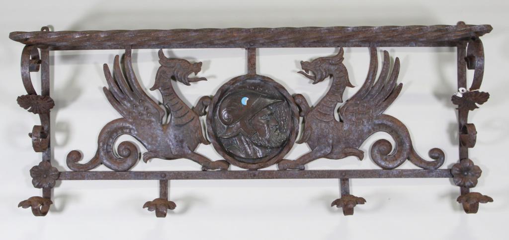 ANTIQUE IRON WALL MOUNTED HAT RACK: ANTIQUE IRON WALL MOUNTED HAT RACK. Height: 19 in. by Width: 39 in. by Depth: 10 in.