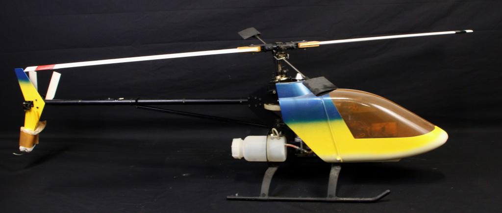 LARGE REMOTE CONTROLLED NITRO POWERED HELICOPTER: LARGE REMOTE CONTROLLED NITRO POWERED HELICOPTER. NO REMOTE CONTROL Height: 17 in. by Width: 55 in. by Depth: 24 in.