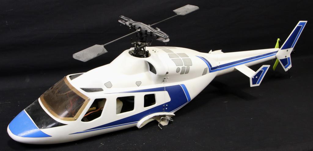 LARGE REMOTE CONTROLLED NITRO POWERED HELICOPTER: LARGE REMOTE CONTROLLED NITRO POWERED HELICOPTER. WITH REMOTE CONTROL Height: 13 in. by Width: 45 in. by Depth: 12 in.