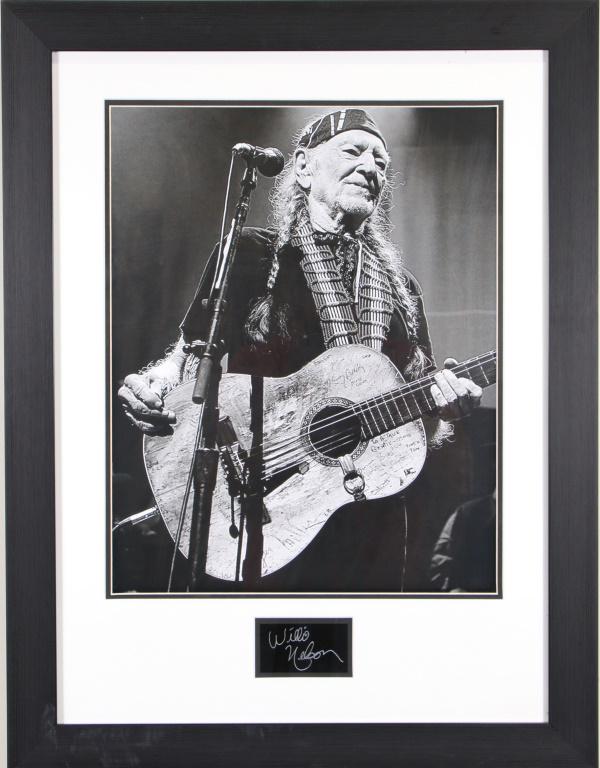FRAMED WILLIE NELSON PHOTO W/PRINTED AUTOGRAPH: FRAMED WILLIE NELSON PHOTO W/PRINTED AUTOGRAPH FROM A PLATE Height: 30 in. by Width: 25 1/2 in. by Depth: 1 IN.