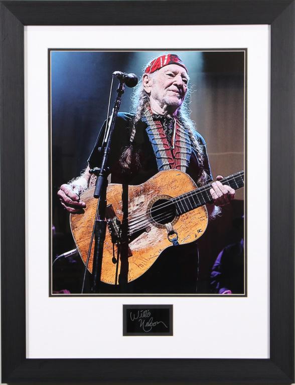 FRAMED WILLIE NELSON PHOTO W/PRINTED SIGNATURE: FRAMED WILLIE NELSON PHOTO SIGNED IN PLATE Height: 30 1/2 in. by Width: 25 1/2 in.