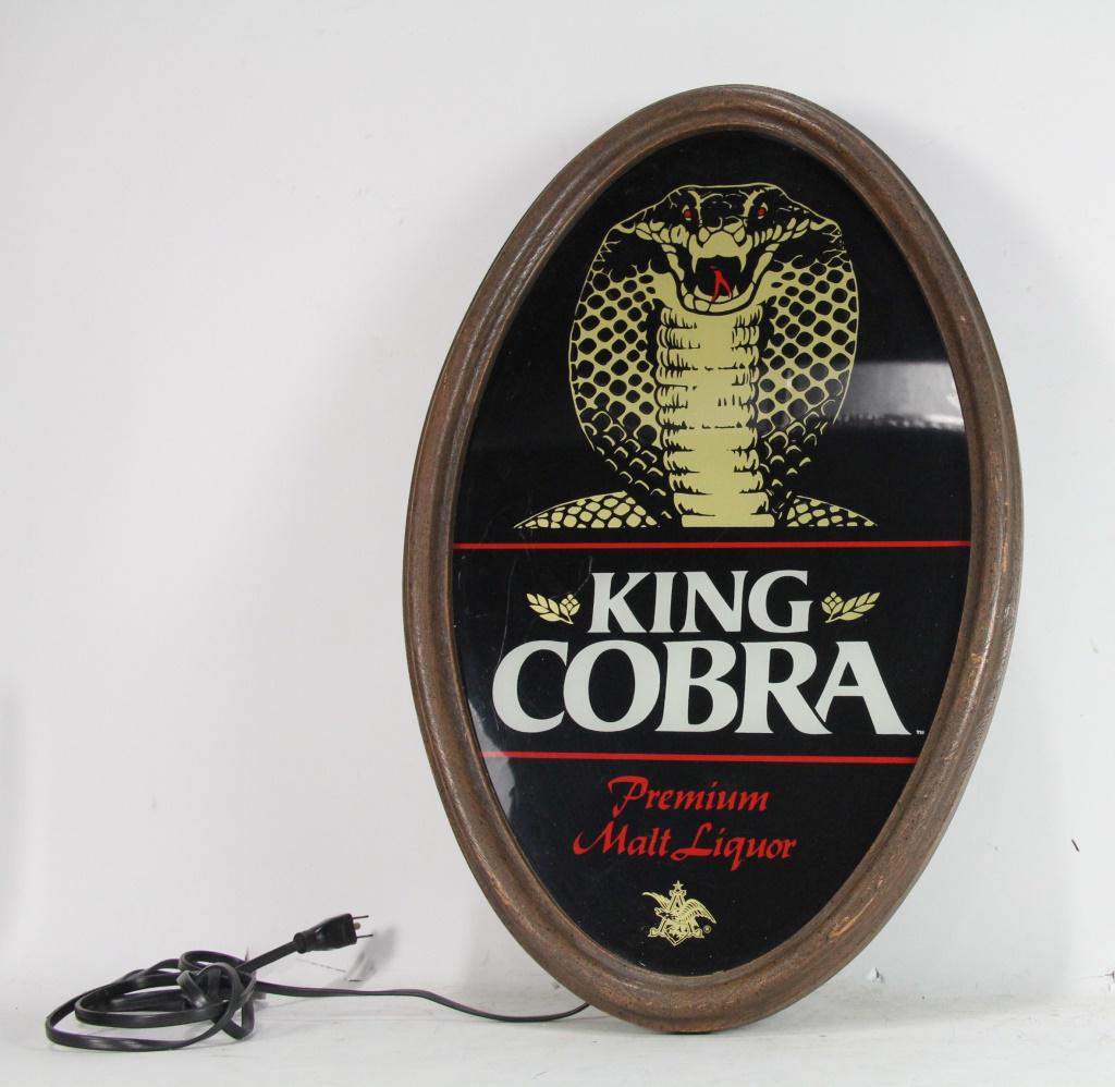 VINTAGE AB KING COBRA MALT LIQUOR LIGHT SIGN: VINTAGE 1986 ANHEUSER BUSCH KING COBRA MALT LIQUOR LIGHTED SIGN WITH LIT SCALES IN MOTION - GREAT, WORKING CONDITION Height: 23 in. by Width: 15 in. by Depth: 4