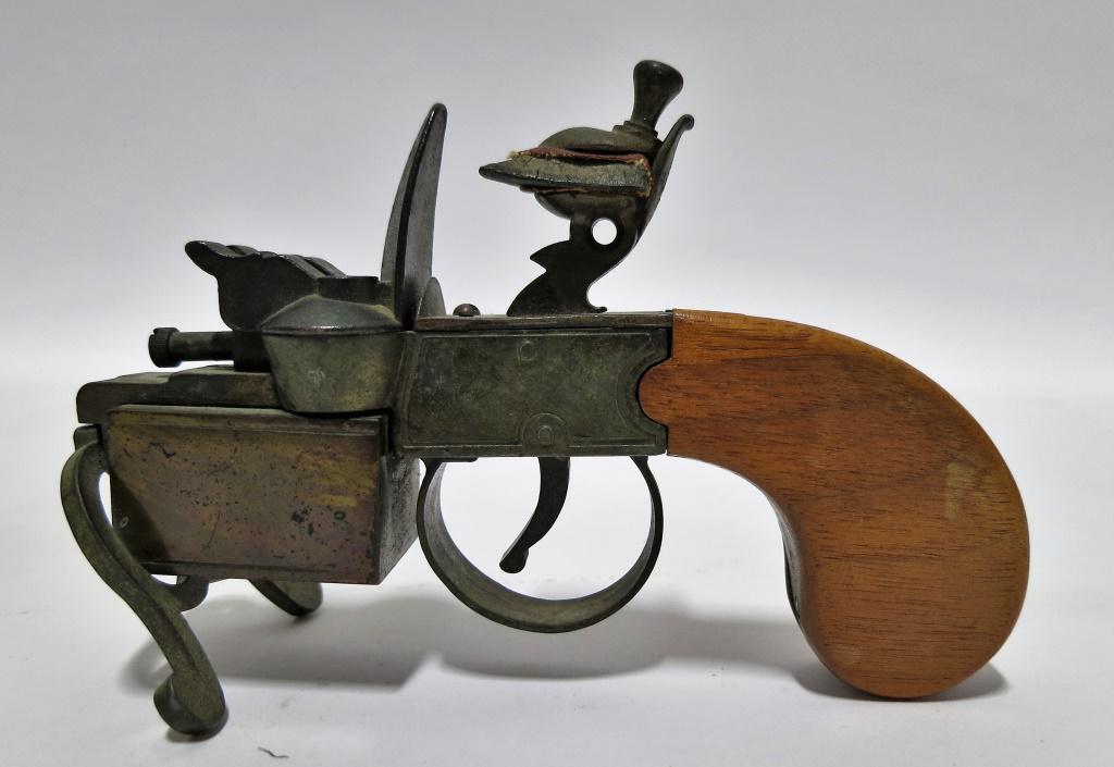 DUNHILL TINDER FLINT PISTOL GUN CIGARETTE LIGHTER: RARE DUNHILL TINDER FLINT PISTOL GUN CIGARETTE CIGAR TABLE LIGHTER. Sold in as is condition. Height: 4 in. by Width: 2.5 in. by Depth: 5 7/8 in.