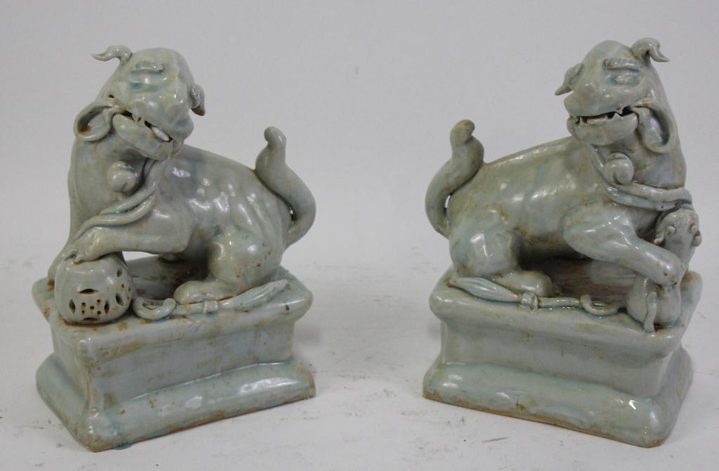 PAIR OF GLAZED PEKING STONEWARE FOO DOGS: PAIR OF GLAZED PEKING STONEWARE FOO DOGS. Height: 12 in. by Width: 9 in. by Depth: 5 IN.