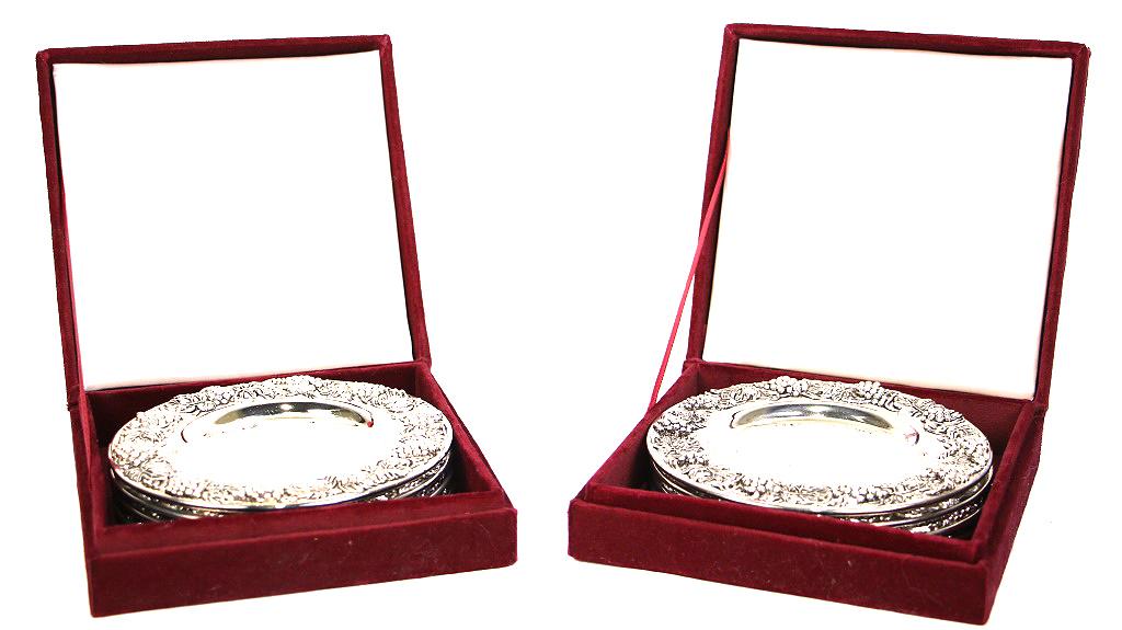 TWO SETS OF FOUR SILVER TREASURES BY GODINGER COASTERS: TWO SETS OF FOUR SILVER TREASURES BY GODINGER COASTERS IN PRESENTATION BOXES. Height: 2 in. by Width: 6 in. by Depth: 6 in.