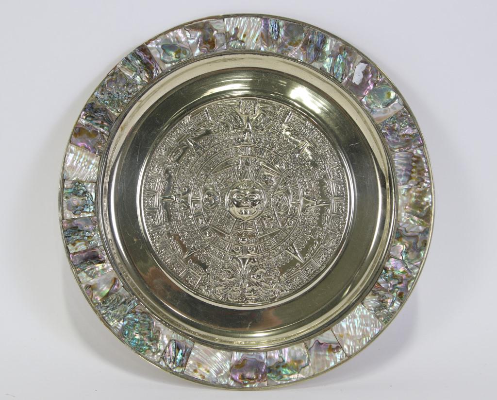 ALPACA STERLING SILVER AND ABALONE AZTEC CALENDER: ALPACA STERLING SILVER AND ABALONE AZTEC CALENDER PLATE. MISSING PIECES ON EDGE TRIM, SOLD AS IS. Height: 1 in. by Width: 11 in. by Depth: 11 IN .