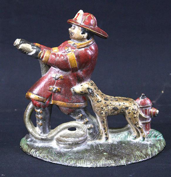 VINTAGE FIREFIGHTER IRON DOOR STOPPER (1 of 3)