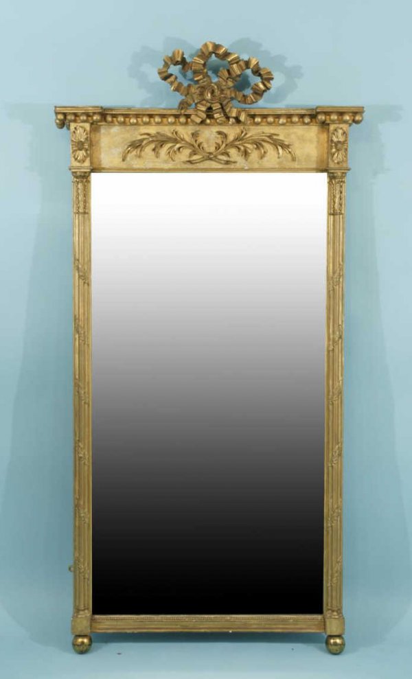 A HIGHLY CARVED AND GILTWOOD MIRROR, CIRCA 1830