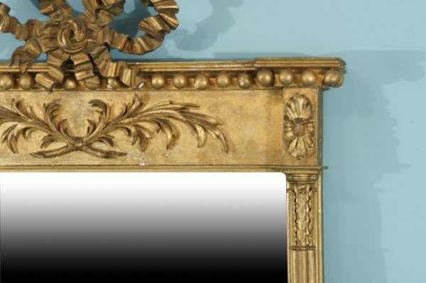 A HIGHLY CARVED AND GILTWOOD MIRROR, CIRCA 1830 - 4